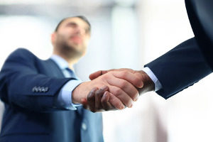 homeowner shaking hands with a Northern VA civil litigation attorney