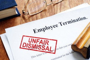 employee reading papers with attorney of wrongful termination