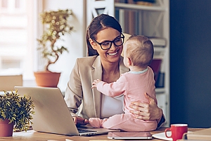 Working mother with baby in office