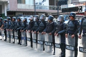 police in line against protector