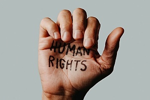 a raised hand with human rights written on it