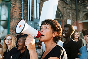 a women using a megaphone expressing her freedom of speech