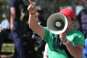 A man using a loudspeaker to execute his right to freedom of speech